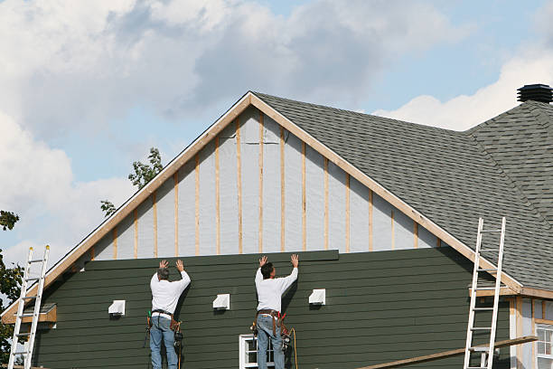 Professional Siding Installation technician working in Timnath, CO